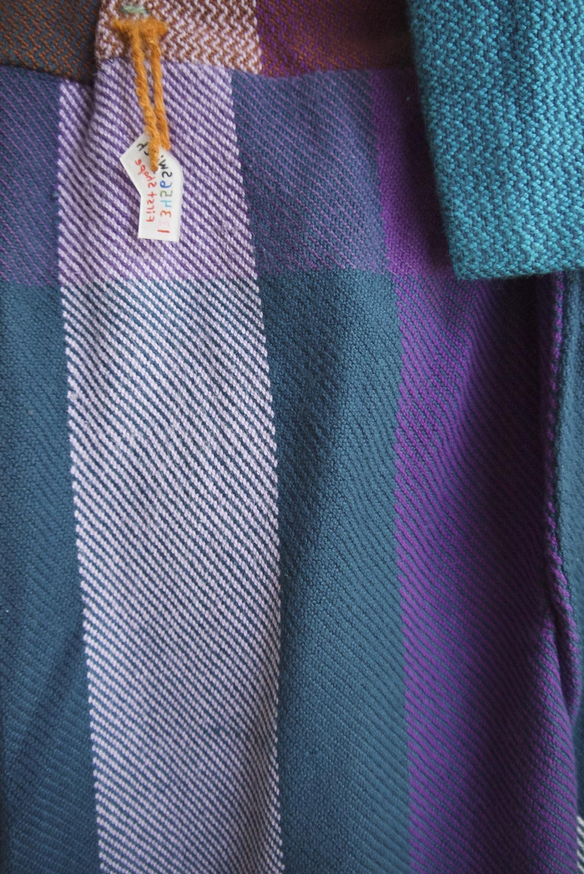 the simple twill weave up-close, with perpendicular stripes of cyan, purple, and pale lilac